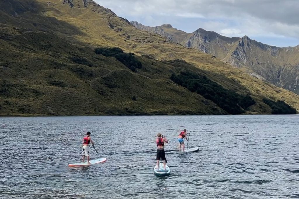 stand up paddleboarding alpine lake